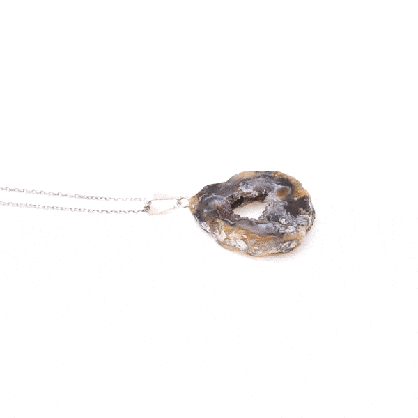 Pendant made of natural agate gemstone with crystal quartz and hypoallergenic silver plated metal. The agate is polished on both sides and the pendant is threaded on a sterling silver chain with adjustable length. Buy online shop.