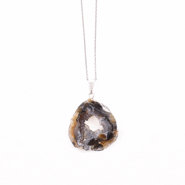 Pendant made of natural agate gemstone with crystal quartz and hypoallergenic silver plated metal. The agate is polished on both sides and the pendant is threaded on a sterling silver chain with adjustable length. Buy online shop.