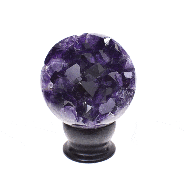 Polished 8cm sphere made from natural amethyst geode gemstone. The sphere comes with a black wooden base.