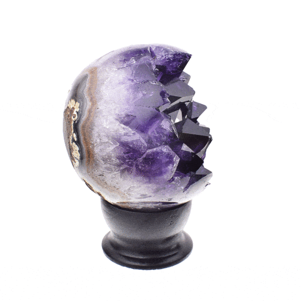 Polished 8cm sphere made from natural amethyst geode gemstone. The sphere comes with a black wooden base.