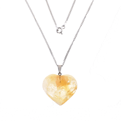 Pendant made from natural citrine quartz gemstone, in the heart shape. The pendant is threaded on a sterling silver chain. 