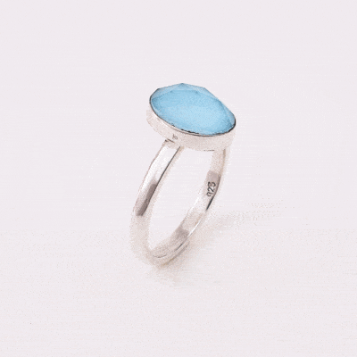 Handmade sterling silver ring with doublet made of natural crystal quartz and turquoise gemstones in an oval shape. The doublet consists of two layers of stones. The upper stone is faceted crystal quartz and the stone at the bottom is turquoise. Buy online shop.