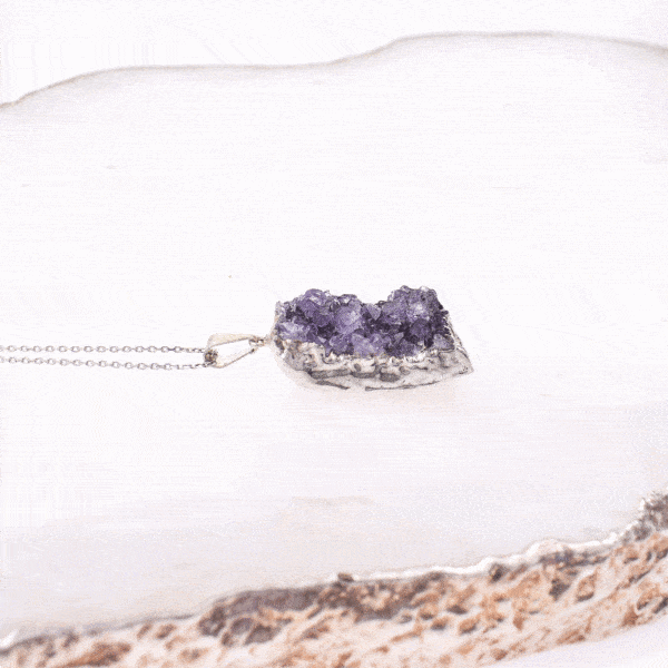 Pendant made of hypoallergenic silver plated metal and natural amethyst gemstone in a raw form. The pendant is threaded on a sterling silver chain with adjustable length. Buy online shop.