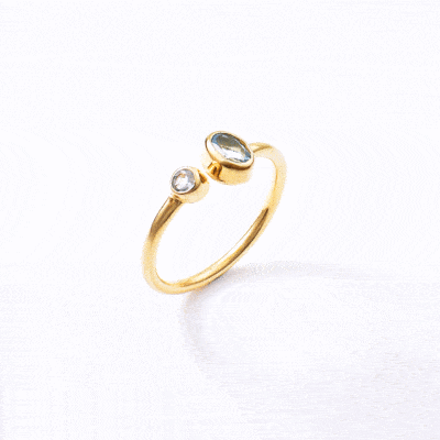 Handmade ring made of gold plated sterling silver and faceted, natural blue topaz gemstone in a round and oval shape. The size of the ring is adjustable. Buy online shop.