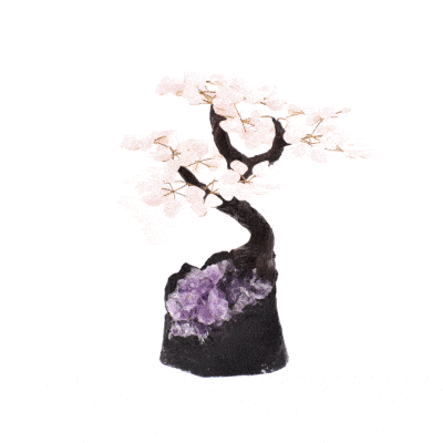 Handmade tree with leaves of natural baroque rose quartz gemstones and natural amethyst base. The tree has a height of 27cm. 