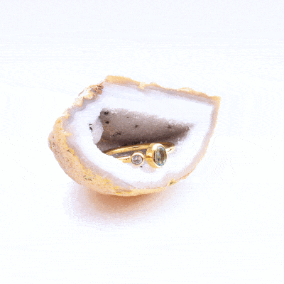 Handmade ring made of gold plated sterling silver and faceted, natural blue topaz gemstone in a round and oval shape. The size of the ring is adjustable. Buy online shop.