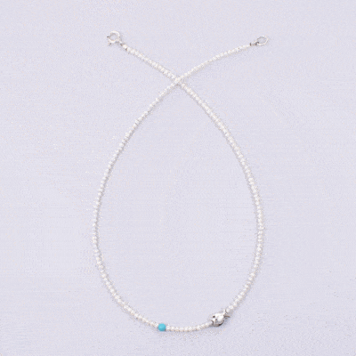 Handmade natural pearl necklace with spherical turquoise stone and a sterling silver fish.