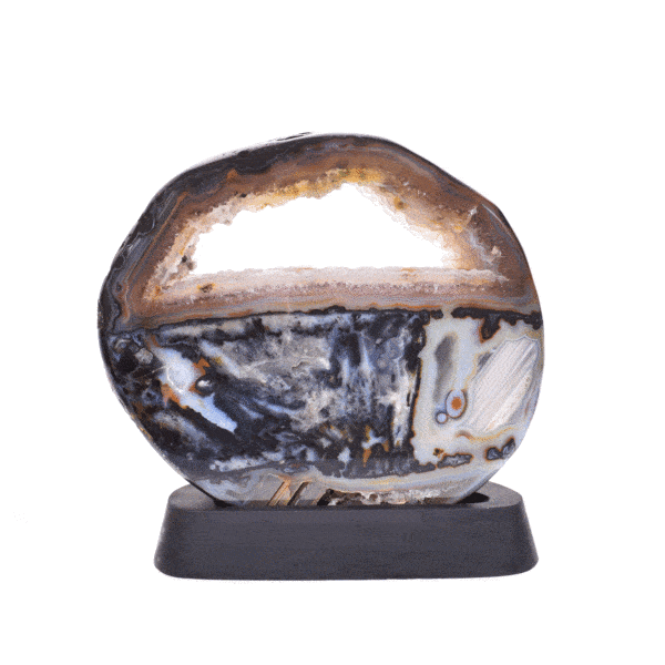 Polished 21.5cm slice of natural agate gemstone with crystal quartz, placed on a black, wooden base.  Buy online shop.