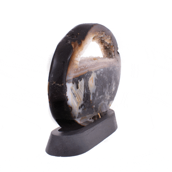 Polished 21.5cm slice of natural agate gemstone with crystal quartz, placed on a black, wooden base.  Buy online shop.