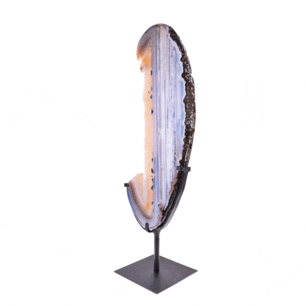 Polished slice of natural agate gemstone with crystal quartz, placed on a black metallic base. The slice of agate with the base has a height of 58.5cm. Buy online shop.