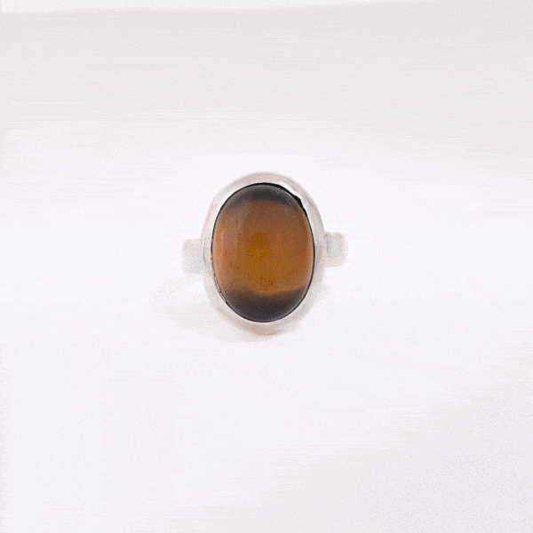 Handmade ring made of sterling silver and natural tiger's eye gemstone in an oval shape. Buy online shop.