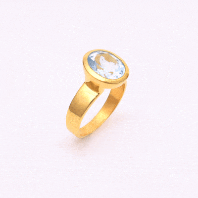 Handmade oval shaped ring made of natural blue topaz stone and gold plated silver 925.