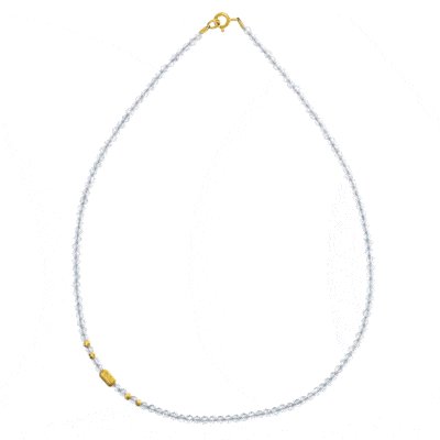 Handmade necklace with natural, faceted blue topaz gemstones in a spherical shape and decorative gold plated sterling silver elements.