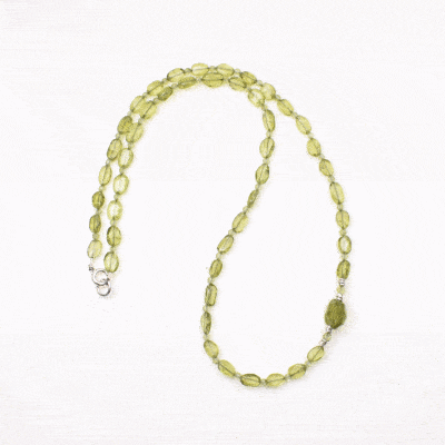 Handmade necklace made of natural, oval and spherical shaped peridot gemstones, decorated with sterling silver elements. Buy online shop.