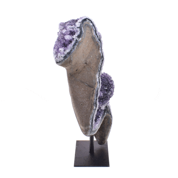 Natural 21cm amethyst gemstone with polished outline, embedded into a black, metallic base.