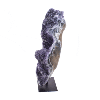 Natural 21cm amethyst gemstone with polished outline, embedded into a black, metallic base.