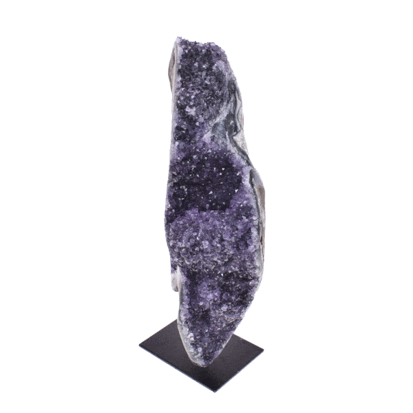 Natural 21cm amethyst gemstone with polished outline, embedded into a black, metallic base.