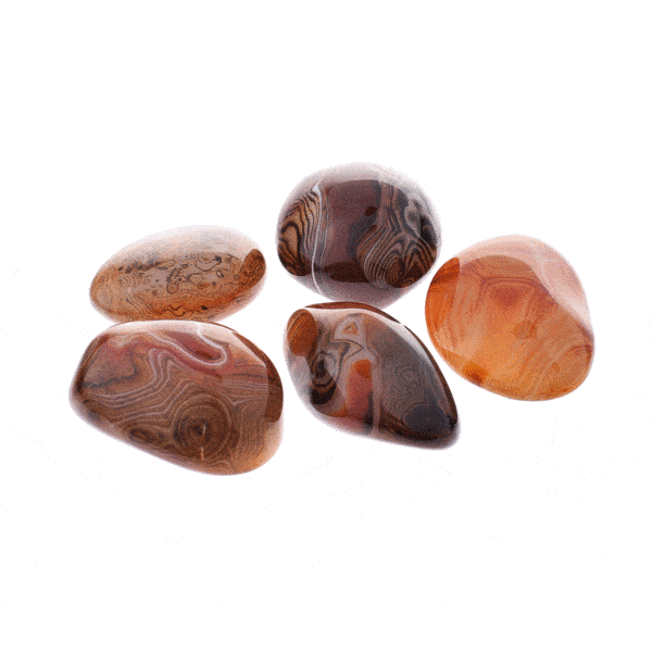 Natural tumbled sardonyx gemstones, ranging from 5cm to 6.5cm. 