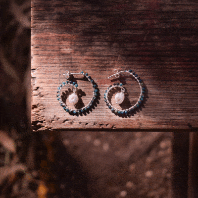 Handmade loop-style earrings made of natural spherical shaped chrysocolla gemstones, natural pearls, and sterling silver.